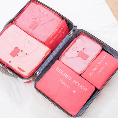Sac de rangement Multifonctionnel plusieurs couleur rose rangés dans valise grise
