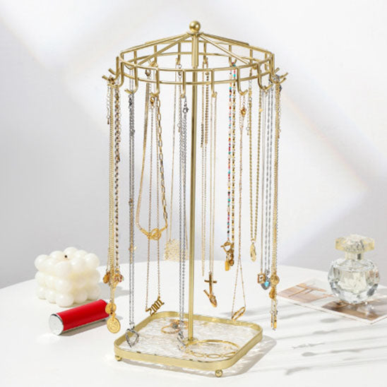 Bijoux-rangement-support-rotatif-rangement-innovant-doré-posé-sur-une-table-moderne-blanche