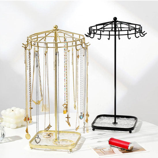Bijoux-rangement-support-rotatif-rangement-innovant-noir-et-doré-posés-sur-une-table-moderne-blanche