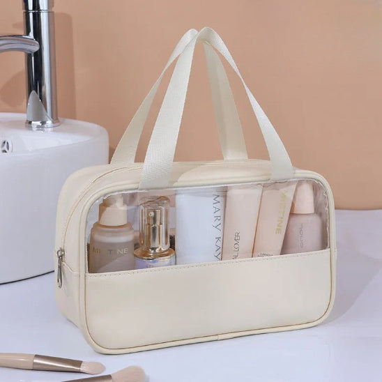Trousse de toilette - Transparente Voyage - beige - fermée - posée sur la table - Rangement innovant