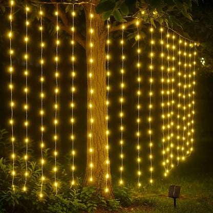 Guirlande solaire Écolight lumière chaude décoration arbre dans jardin